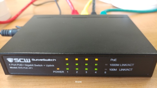 4 ip cameras plugged into switch - back